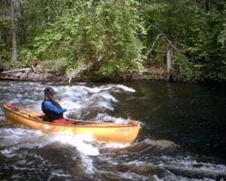 River-Wide Surfing Wave